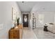 Inviting entryway with a dark wooden console table and decorative elements at 12017 Baywoods Dr, Tega Cay, SC 29708