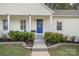 Charming house with a blue front door and well-maintained landscaping at 12017 Baywoods Dr, Tega Cay, SC 29708