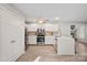 Modern kitchen with white cabinets and stainless steel appliances at 12017 Baywoods Dr, Tega Cay, SC 29708