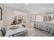 Kitchen with island, white cabinets, and stainless steel appliances at 12017 Baywoods Dr, Tega Cay, SC 29708