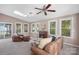 Living room with leather sofas and a fireplace at 12017 Baywoods Dr, Tega Cay, SC 29708