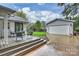 Deck with patio furniture and view of detached garage at 1915 Wedgedale Dr, Charlotte, NC 28210