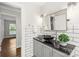 Modern bathroom with black and white tile and updated vanity at 1915 Wedgedale Dr, Charlotte, NC 28210