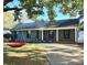 Gray house with a red swing and driveway at 1915 Wedgedale Dr, Charlotte, NC 28210