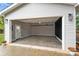 Spacious garage with painted floor and overhead storage at 1915 Wedgedale Dr, Charlotte, NC 28210