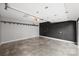 Garage interior with painted concrete floor and storage racks at 1915 Wedgedale Dr, Charlotte, NC 28210