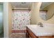 Clean bathroom with a shower/tub combo, a vanity with sink, and a decorative shower curtain at 316 Brawley Rd, Cleveland, NC 27013