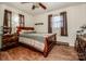 Charming bedroom featuring hardwood floors and a wooden sleigh bed at 316 Brawley Rd, Cleveland, NC 27013