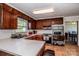 L-shaped kitchen with stainless steel appliances and wood cabinets at 316 Brawley Rd, Cleveland, NC 27013