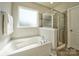 Bathroom with soaking tub and walk-in shower at 4540 Potters Wheel Dr, Fort Mill, SC 29715