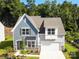 Two-story home with gray siding, white accents, and a two-car garage at 4540 Potters Wheel Dr, Fort Mill, SC 29715