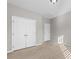 Spacious bedroom with double doors leading to a closet and an additional door at 6941 Augustine Way, Charlotte, NC 28270