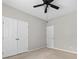 Bedroom with double doors and ceiling fan at 6941 Augustine Way, Charlotte, NC 28270