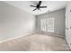 Well-lit bedroom with neutral walls and carpet at 6941 Augustine Way, Charlotte, NC 28270