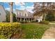 Brick two-story house with landscaping and a spacious lawn at 6941 Augustine Way, Charlotte, NC 28270