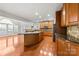 Open kitchen with large island and hardwood floors at 6941 Augustine Way, Charlotte, NC 28270