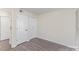 Bedroom with wood-look flooring featuring a double closet perfect for storage solutions at 1101 E Morehead St # 32, Charlotte, NC 28204