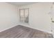 Bright bedroom with luxury vinyl floors and a large window offering great natural light at 1101 E Morehead St # 32, Charlotte, NC 28204