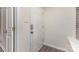 A clean, bright entrance with a security door, neutral walls and modern flooring at 1101 E Morehead St # 32, Charlotte, NC 28204