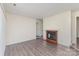 Open-concept living area featuring modern flooring and a classic fireplace, perfect for relaxation at 1101 E Morehead St # 32, Charlotte, NC 28204