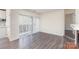 Bright, open living space with sliding glass doors and luxury vinyl plank flooring at 1101 E Morehead St # 32, Charlotte, NC 28204