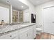 Bathroom features a double vanity with granite countertops and a separate shower at 159 Tanner Loop, Troutman, NC 28166