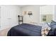 This neutrally-toned bedroom is a blank canvas ready to be decorated, and offers a large window and comfortable queen bed at 159 Tanner Loop, Troutman, NC 28166