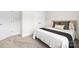 Inviting bedroom featuring neutral carpet and paint and a comfortable queen-size bed with stylish pillows and bedding at 159 Tanner Loop, Troutman, NC 28166