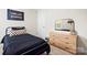 Relaxing bedroom with neutral colors, large window, and a comfortable queen bed, ready for a good night's sleep at 159 Tanner Loop, Troutman, NC 28166