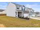 Well-maintained home boasting a spacious lawn, two-car garage, and classic suburban charm at 159 Tanner Loop, Troutman, NC 28166
