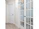 Hallway features two white doors and a glass-paned door with a basketball hoop at 159 Tanner Loop, Troutman, NC 28166