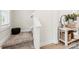 Hallway view with carpeted stairs and a small console table at 159 Tanner Loop, Troutman, NC 28166