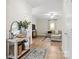 Inviting entryway flowing into a living room, styled with modern furnishings and warm accents at 159 Tanner Loop, Troutman, NC 28166