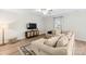 Inviting living room featuring a cozy sectional sofa, modern ceiling fan, and neutral color palette at 159 Tanner Loop, Troutman, NC 28166