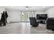 Finished basement recreation room with TV, seating, and access to backyard at 1926 Hopewell Church Rd, Sherrills Ford, NC 28673
