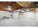 Unfinished basement workshop with garage door access at 1926 Hopewell Church Rd, Sherrills Ford, NC 28673