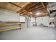 Unfinished basement workshop area with pegboard and shelving at 1926 Hopewell Church Rd, Sherrills Ford, NC 28673