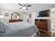 Large bedroom with king bed, dresser, and access to bathroom at 1926 Hopewell Church Rd, Sherrills Ford, NC 28673