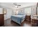 Spacious primary bedroom with hardwood floors, ceiling fan, and ensuite bathroom at 1926 Hopewell Church Rd, Sherrills Ford, NC 28673