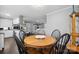 Bright dining area with wood table and chairs, adjacent to kitchen at 1926 Hopewell Church Rd, Sherrills Ford, NC 28673