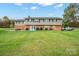 Back exterior view of two-story home with patio and yard at 1926 Hopewell Church Rd, Sherrills Ford, NC 28673