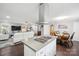 Open kitchen with island, gas cooktop, stainless steel appliances, and breakfast area at 1926 Hopewell Church Rd, Sherrills Ford, NC 28673