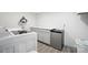 Bright laundry room with cabinets and mini-fridge at 1926 Hopewell Church Rd, Sherrills Ford, NC 28673