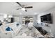 Bright living room with fireplace, white furniture, and hardwood floors at 1926 Hopewell Church Rd, Sherrills Ford, NC 28673