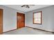 Simple bedroom with wood closet doors and carpet at 256 Henry Rd, Taylorsville, NC 28681