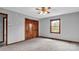 Bright bedroom with wood closet doors and carpet flooring at 256 Henry Rd, Taylorsville, NC 28681