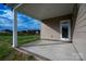 Covered porch with concrete flooring, offering a view of the backyard and access to the home at 3034 Buffet Ln, Monroe, NC 28110