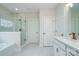 Bathroom features tiled floors, glass enclosed shower, double sink vanity, and separate toilet area at 3034 Buffet Ln, Monroe, NC 28110