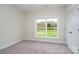Comfortable bedroom featuring neutral carpet, a large window, and a closet at 3034 Buffet Ln, Monroe, NC 28110