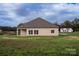 New home with an outdoor space, visible lawn and blue sky with few surrounding houses at 3034 Buffet Ln, Monroe, NC 28110